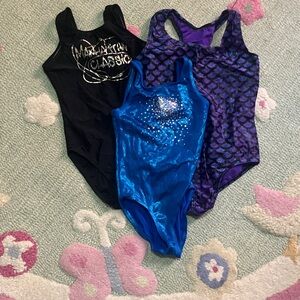 Black, Blue, and Purple Gymnastics Leotards